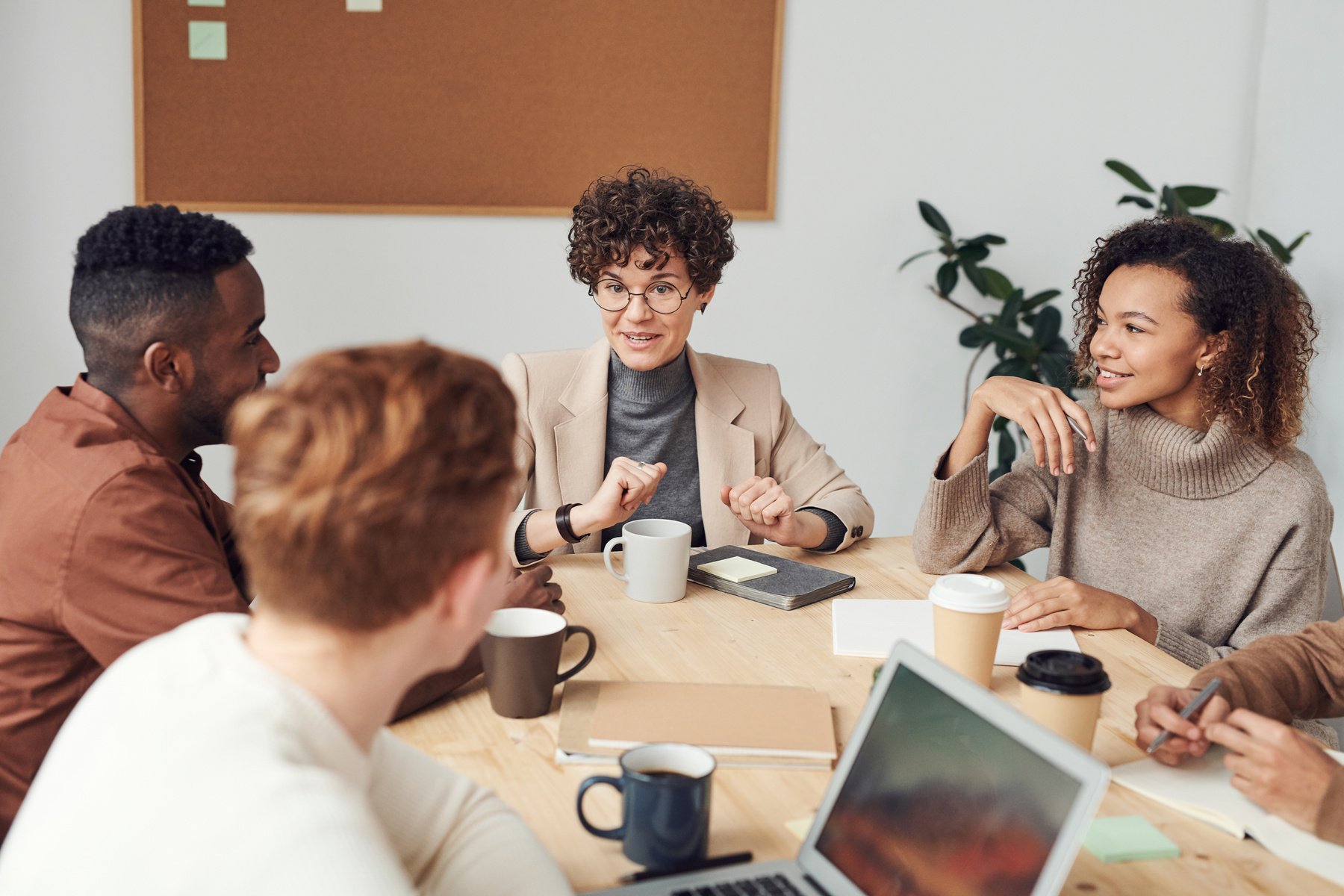 Diverse group of young professionals collaborating in the office